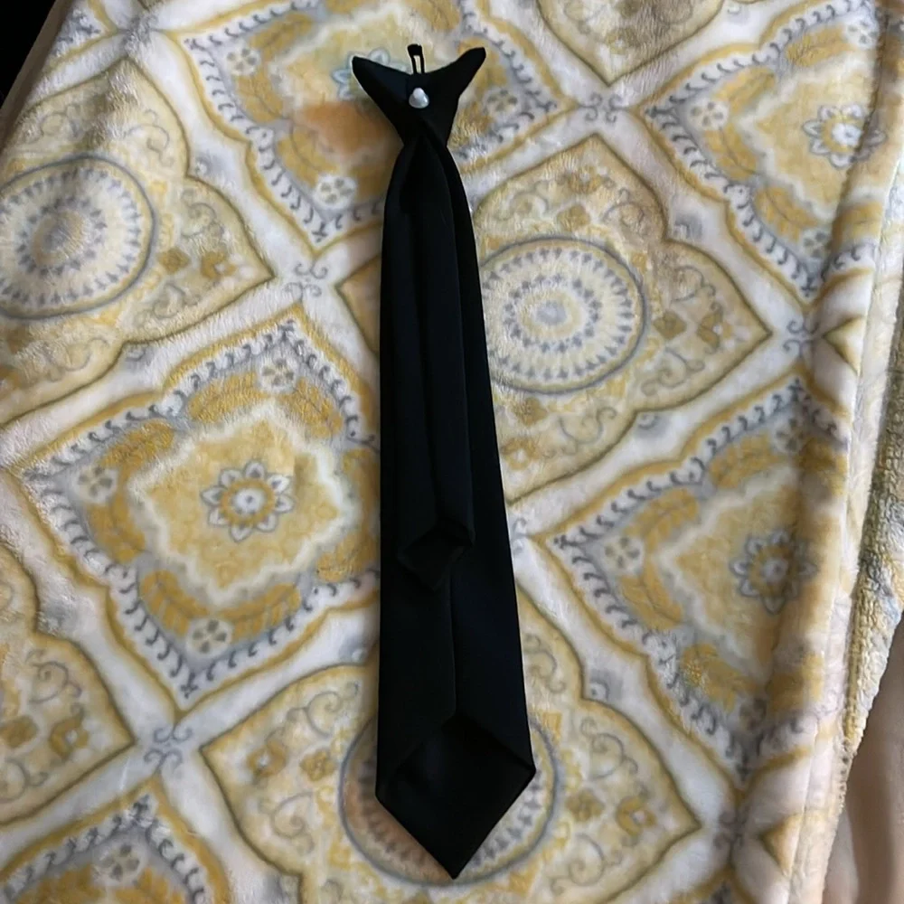 Young men’s/boys black satin clip on tie. Brand new never worn.